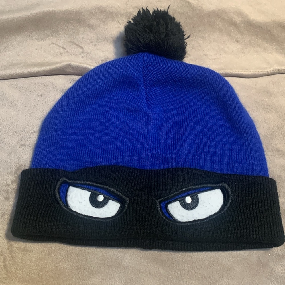 Blue Beanie with Black Pom Pom and Eyes Design